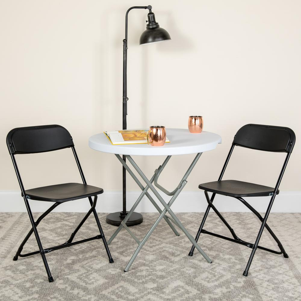 HERCULES Series 650 lb. Capacity Premium Black Plastic Folding Chair